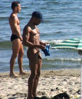black-nudist-guy-caught-changing-speedo-beach-.jpg